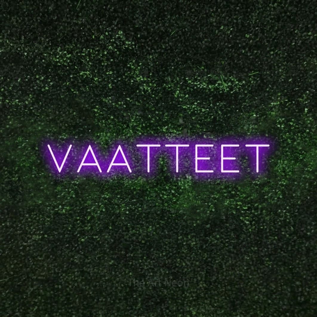 LED neon sign reading “VAATTEET”, arranged in a single line.