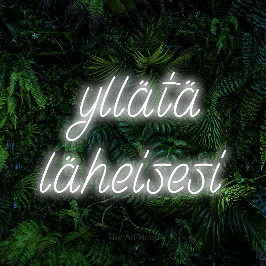 LED neon sign reading “yllätä läheisesi”, arranged in 2 lines.