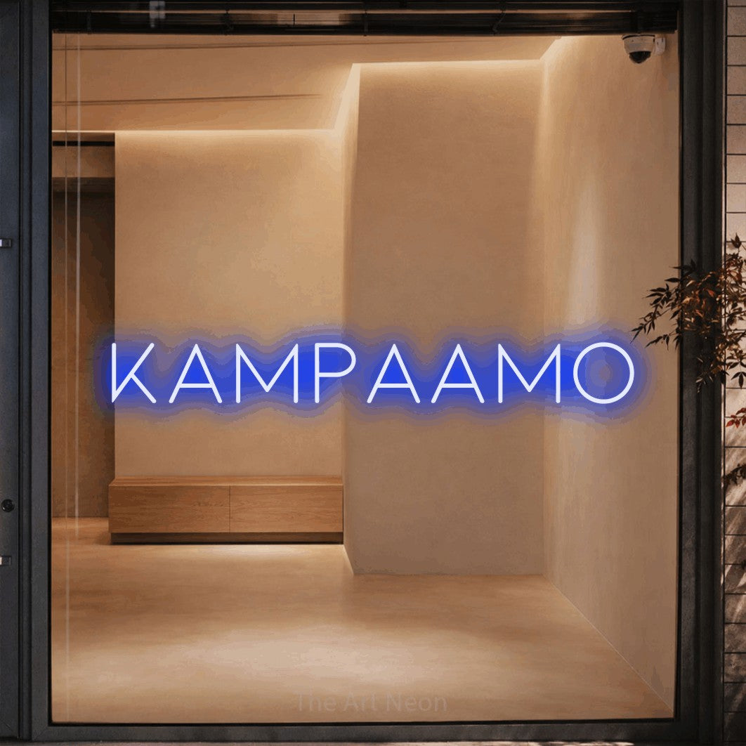 LED neon sign reading “KAMPAAMO”, arranged in a single line.