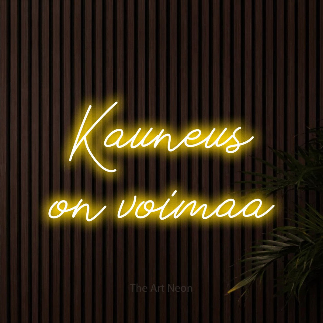 LED neon sign reading “Kauneus on voimaa”, arranged in 2 lines.