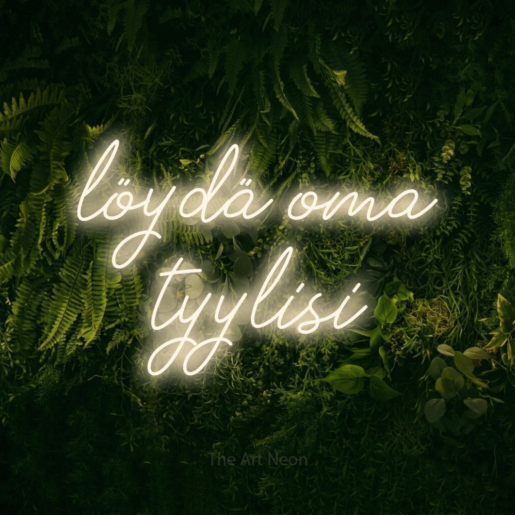 LED neon sign reading “löydä oma tyylisi”, arranged in 2 lines.