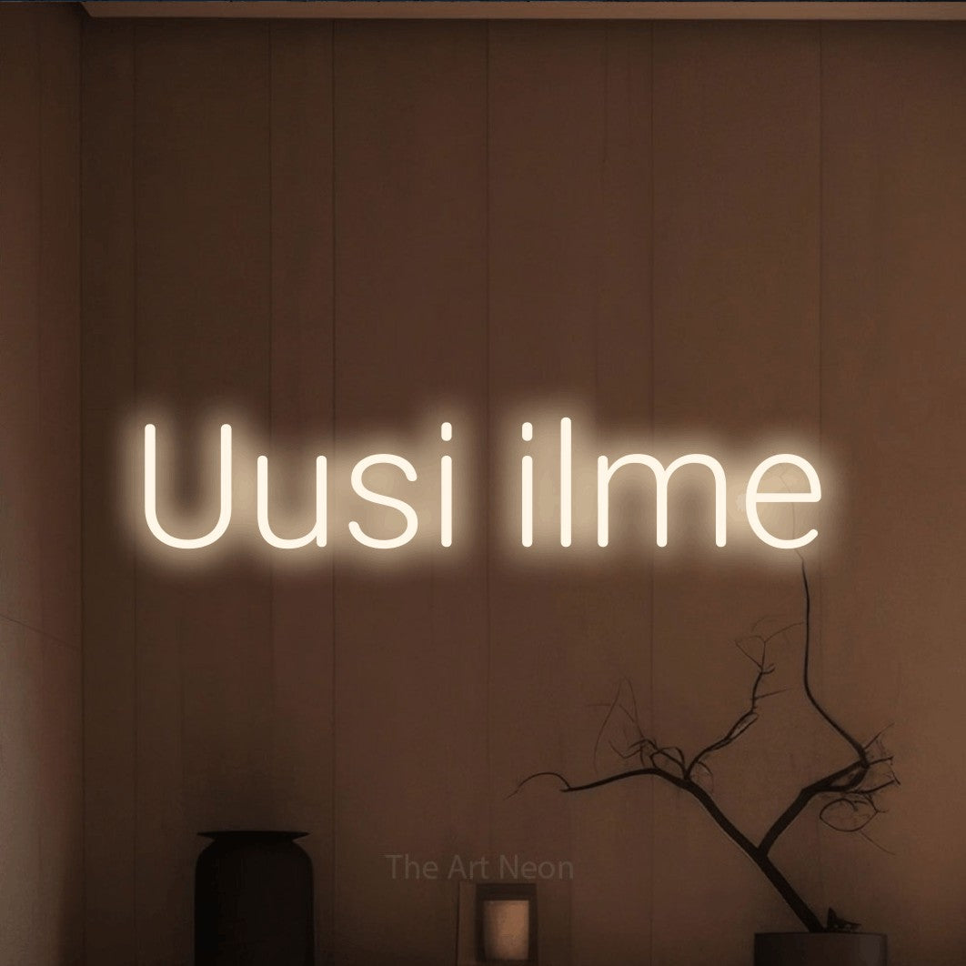 LED neon sign reading “Uusi ilme”, arranged in a single line.