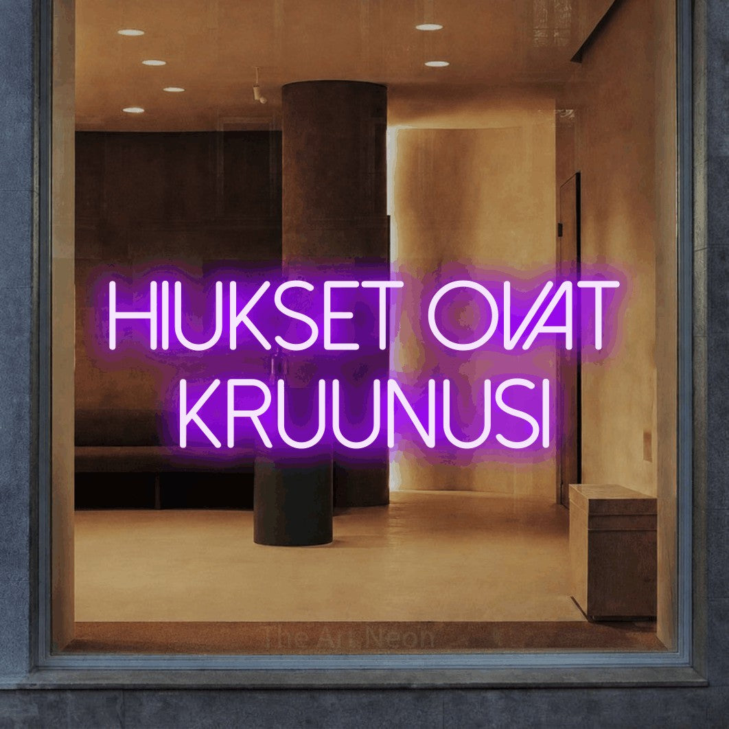 LED neon sign reading “hiukset ovat kruunusi”, arranged in 2 lines.