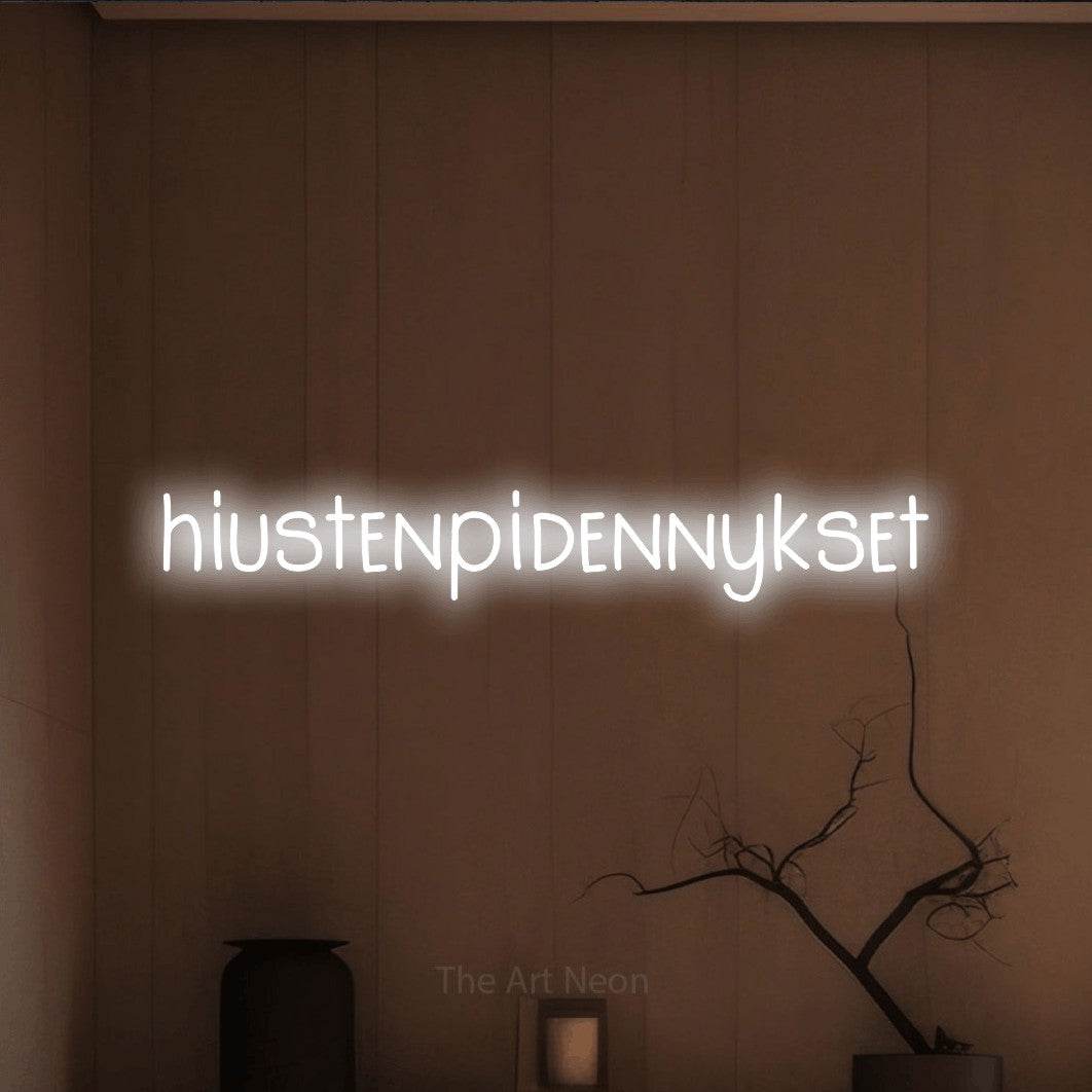 LED neon sign reading “hiustenpidennykset”, arranged in a single line.