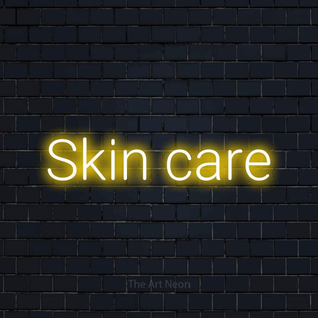 LED neon sign reading “Skin care”, arranged in a single line.