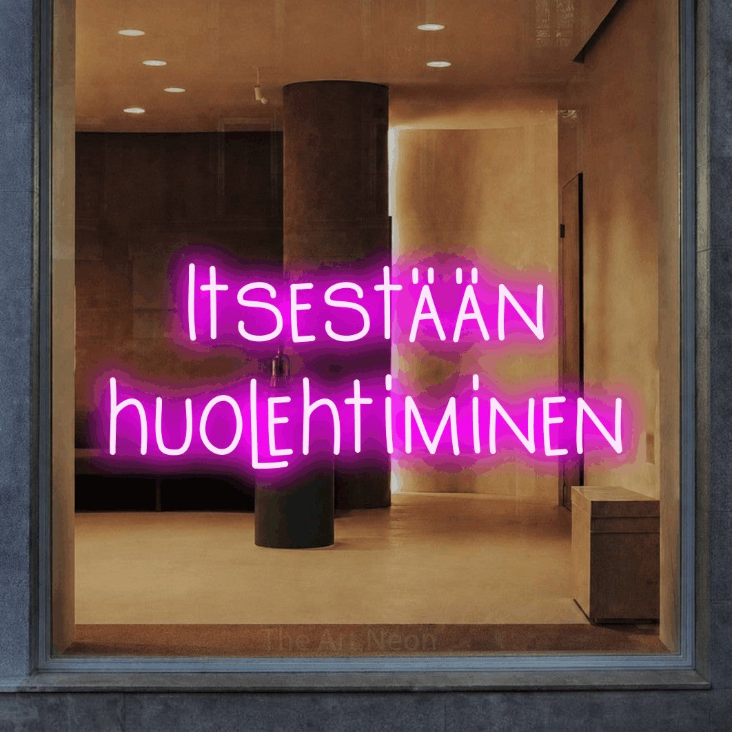 LED neon sign reading “Itsestään huolehtiminen”, arranged in 2 lines.