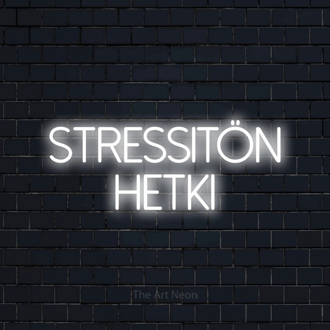 LED neon sign reading “stressitön hetki”, arranged in 2 lines.