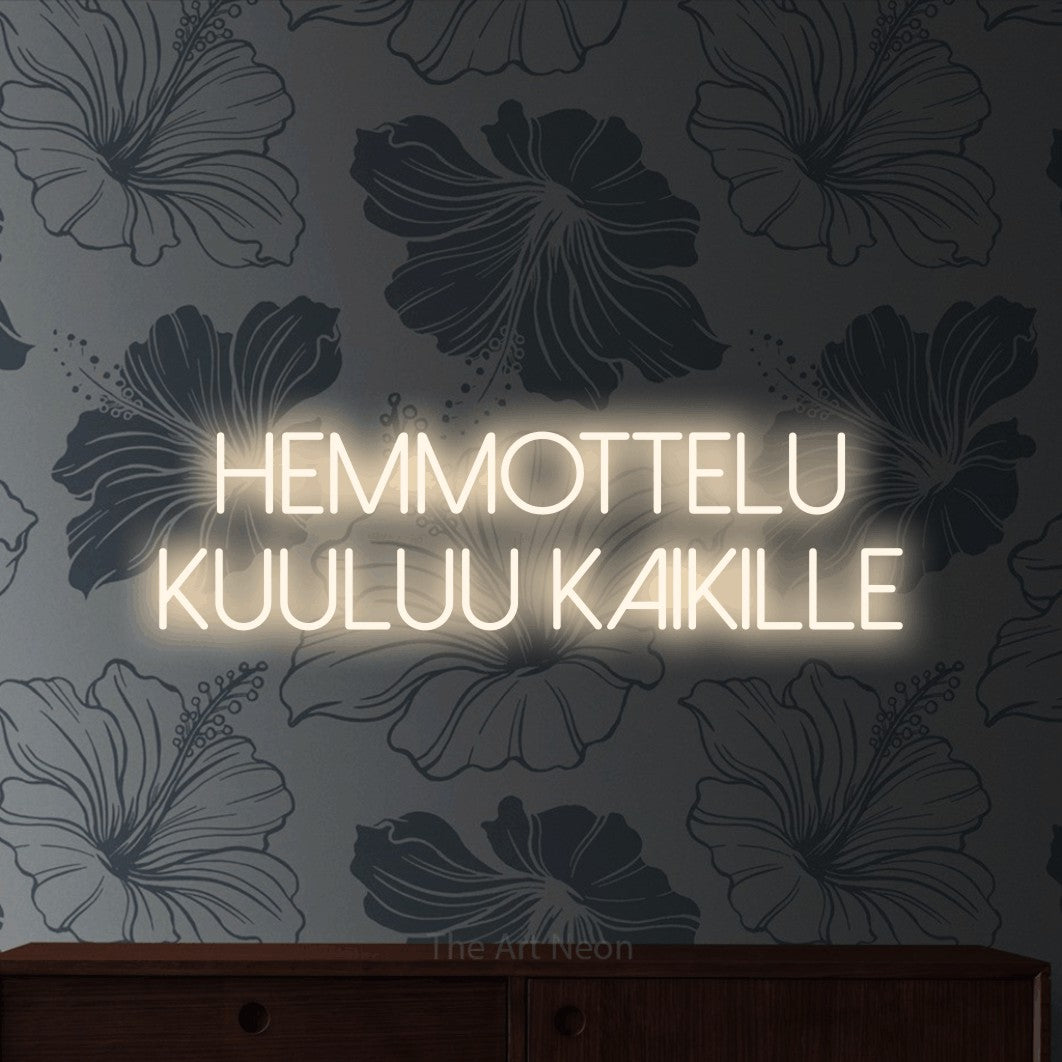 LED neon sign reading “HEMMOTTELU KUULUU KAIKILLE”, arranged in 2 lines.
