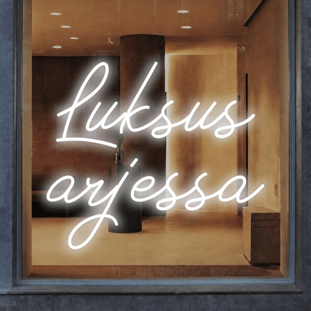 LED neon sign reading “Luksus arjessa”, arranged in 2 lines.