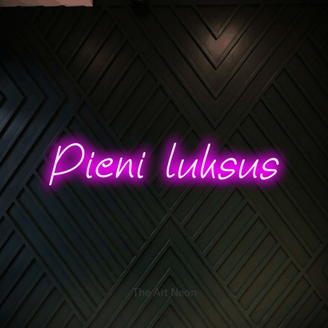 LED neon sign reading “Pieni luksus”, arranged in a single line.