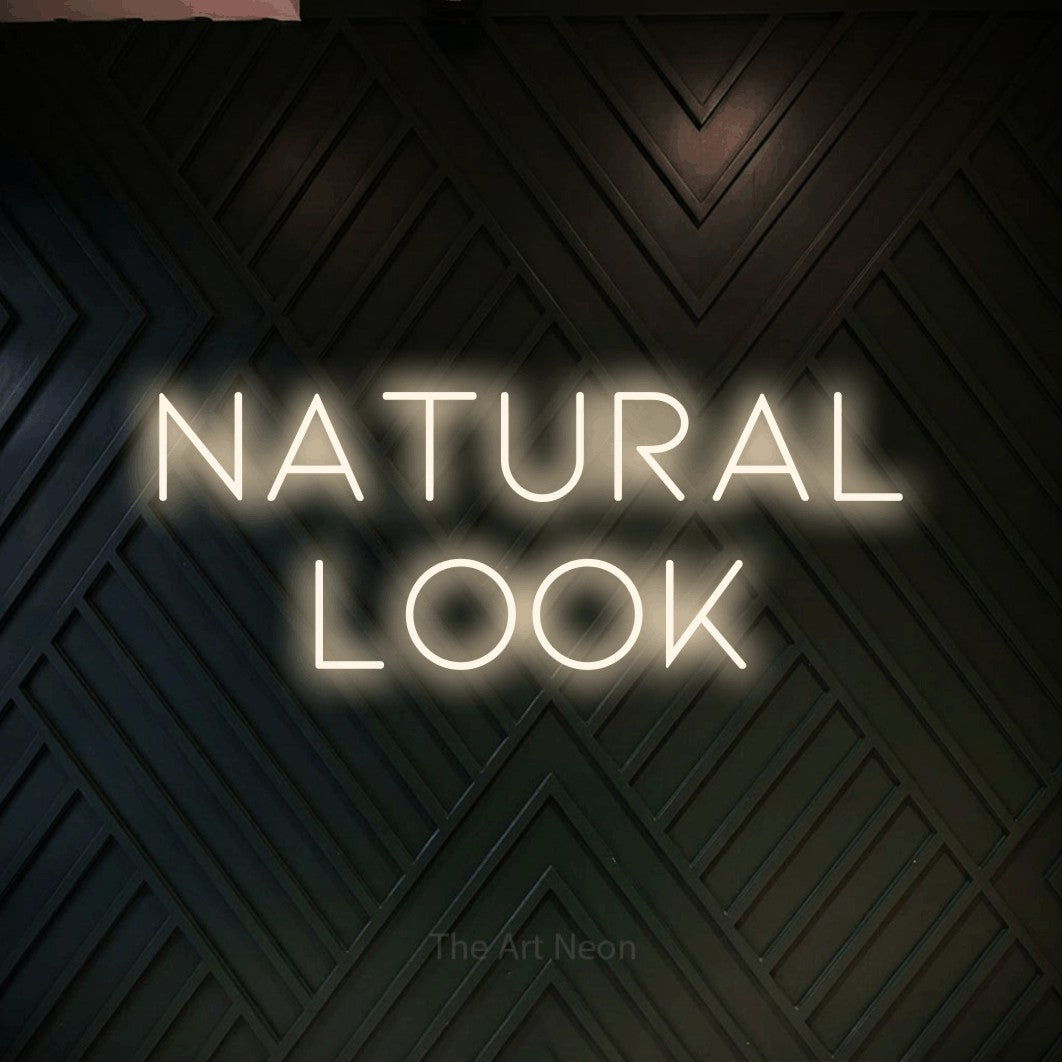 LED neon sign reading “NATURAL look”, arranged in 2 lines.