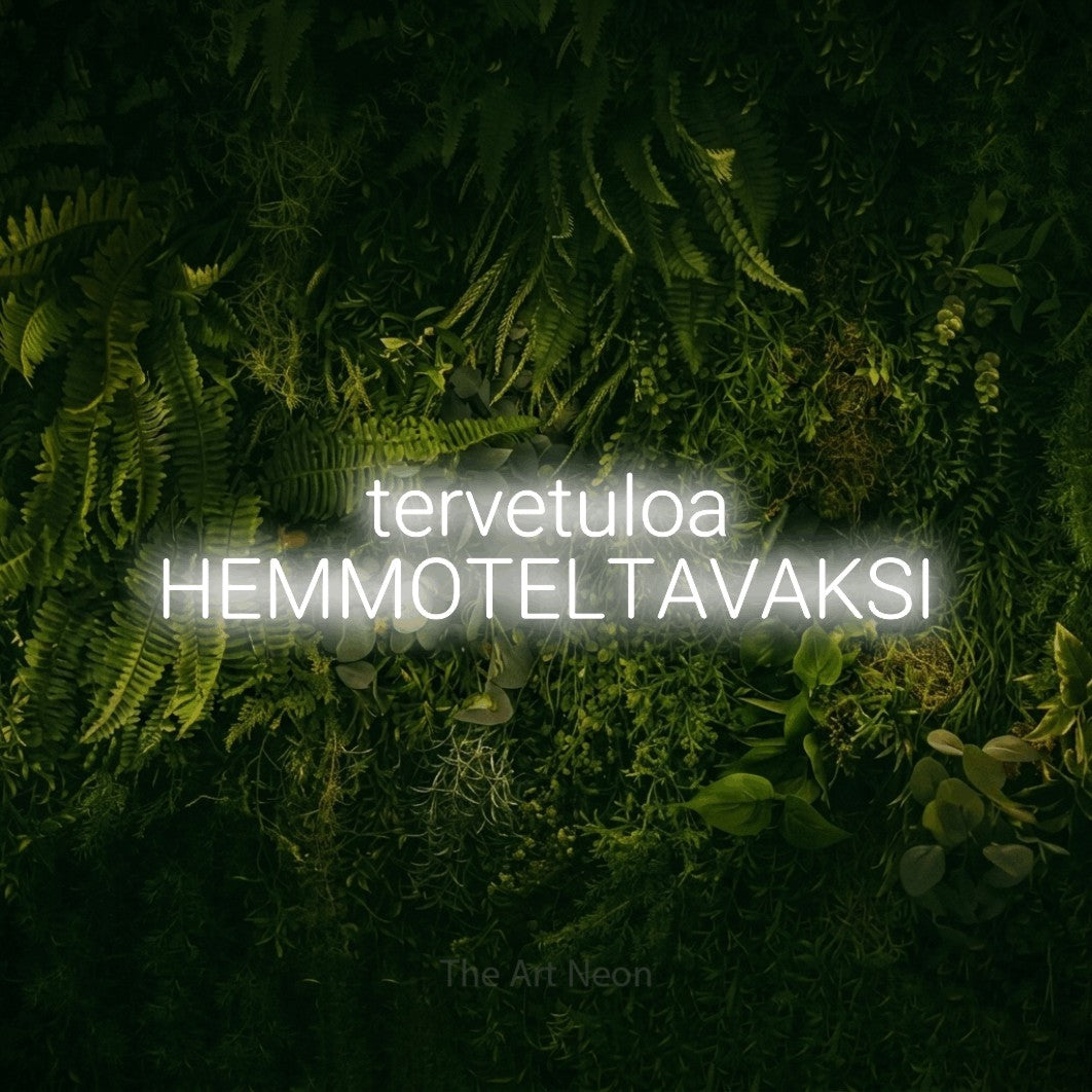 LED neon sign reading “tervetuloa HEMMOTELTAVAKSI”, arranged in 2 lines.