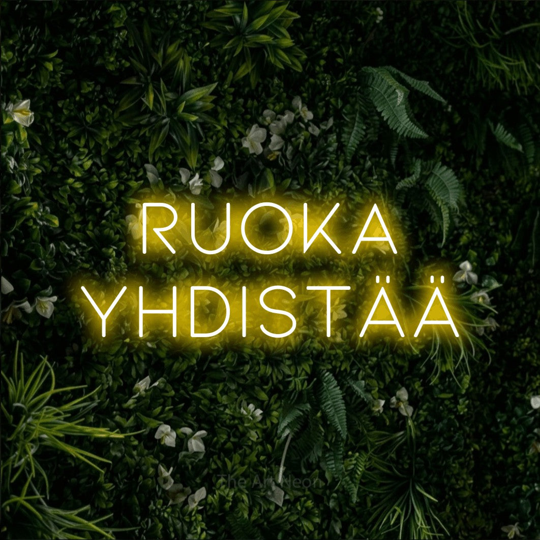 LED neon sign reading “ruoka YHDISTÄÄ”, arranged in 2 lines.
