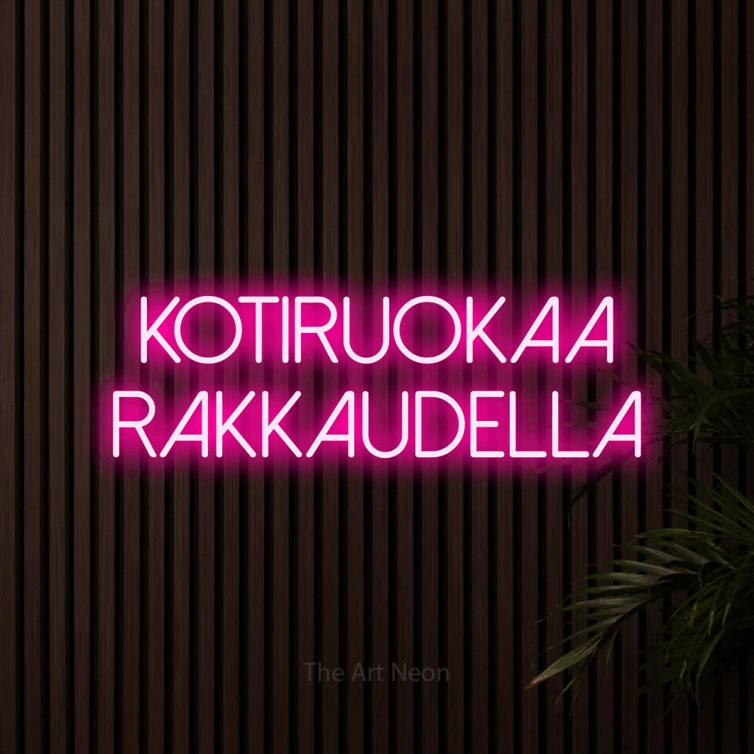 LED neon sign reading “KOTIRUOKAA RAKKAUDELLA”, arranged in 2 lines.