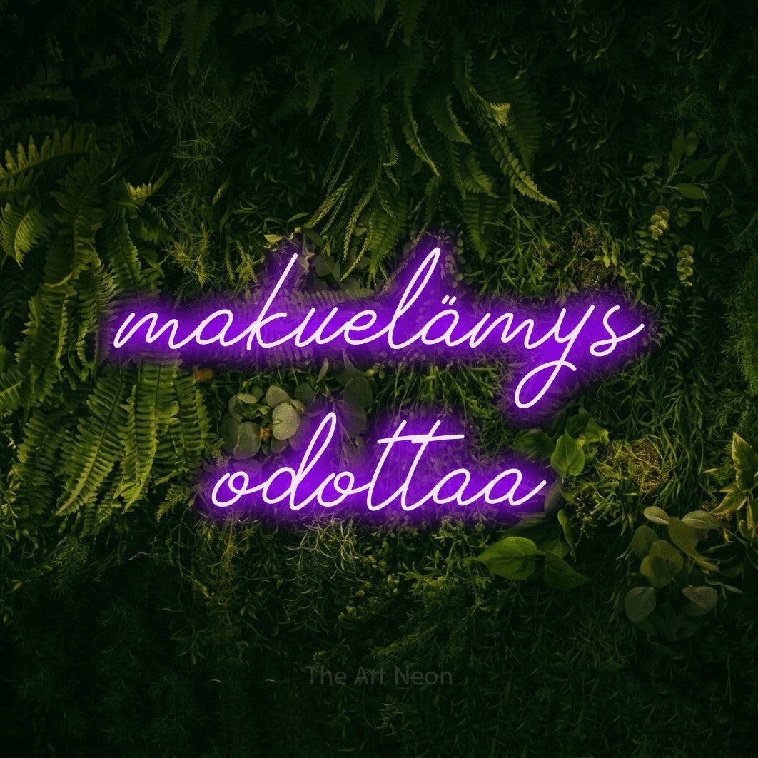 LED neon sign reading “makuelämys odottaa”, arranged in 2 lines.