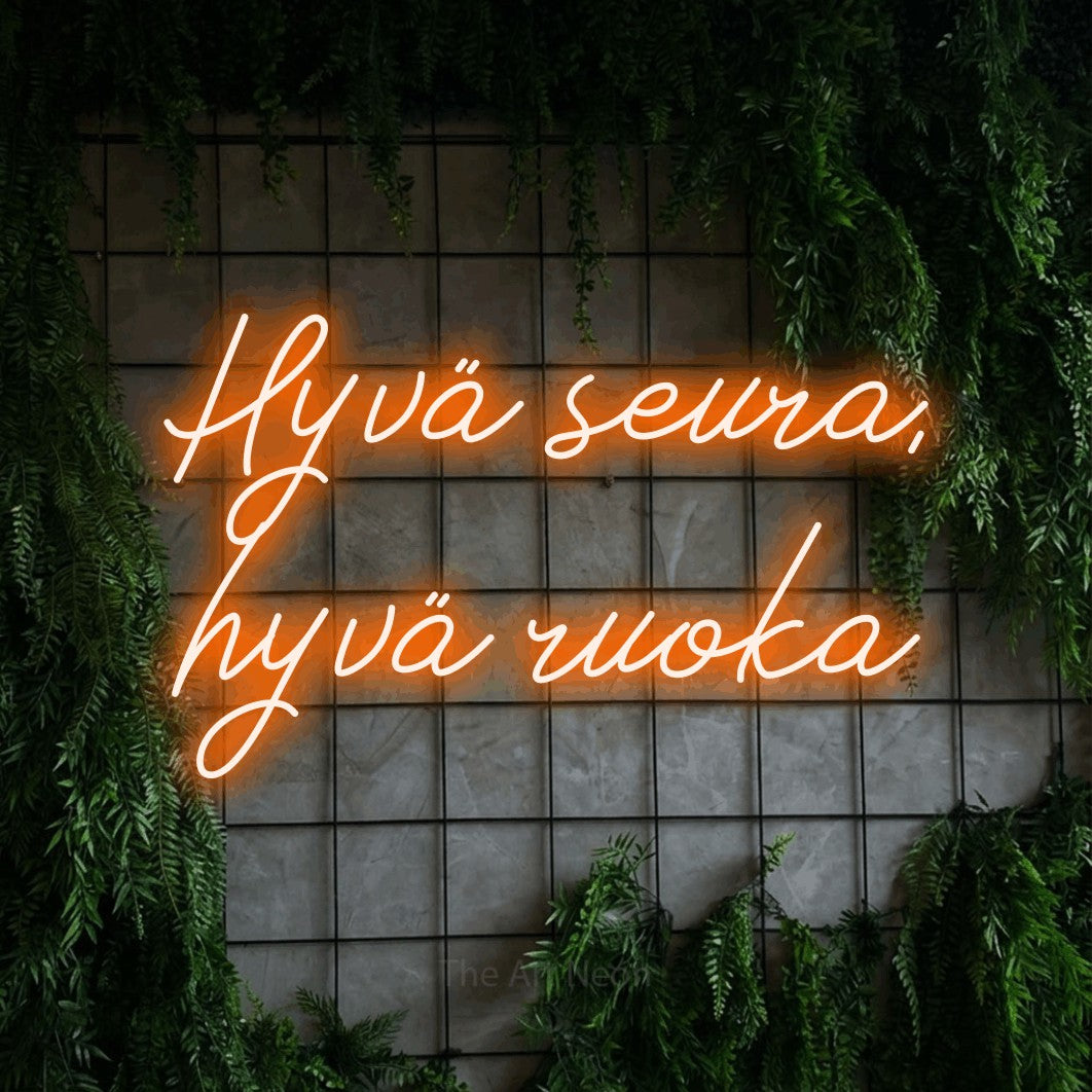 LED neon sign reading “Hyvä seura, hyvä ruoka”, arranged in 2 lines.