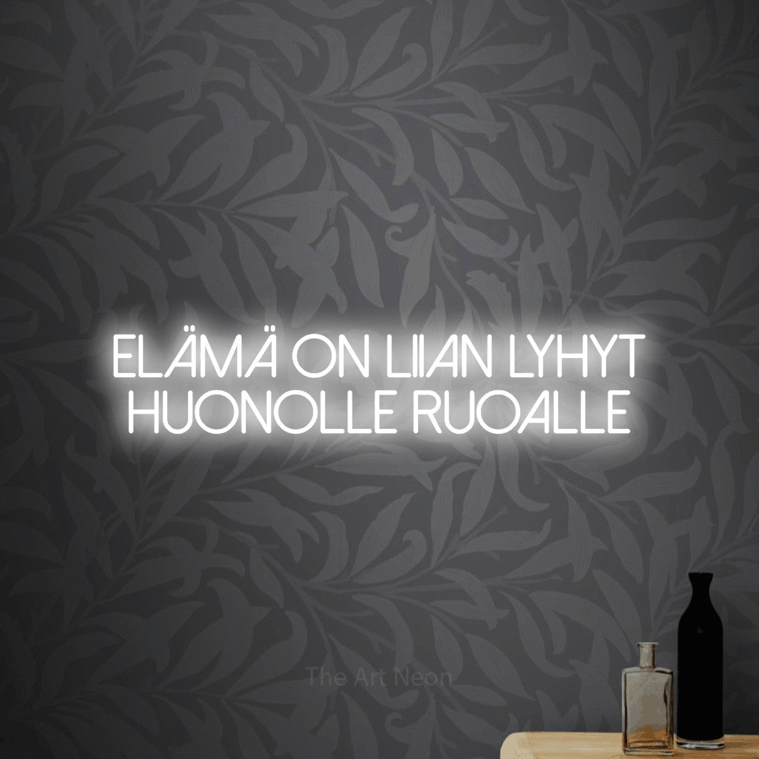 LED neon sign reading “Elämä on liian lyhyt huonolle ruoalle”, arranged in 2 lines.