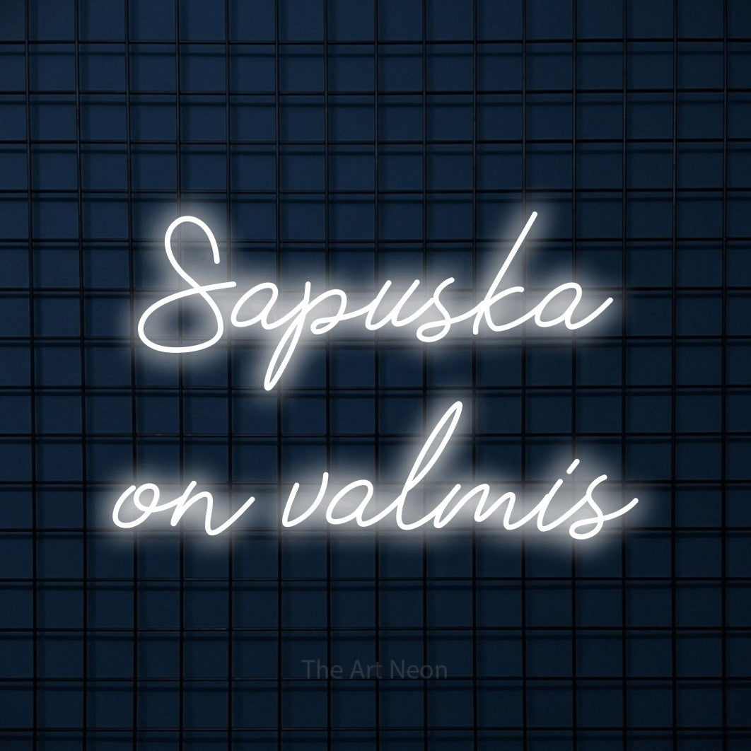 LED neon sign reading “Sapuska on valmis”, arranged in 2 lines.