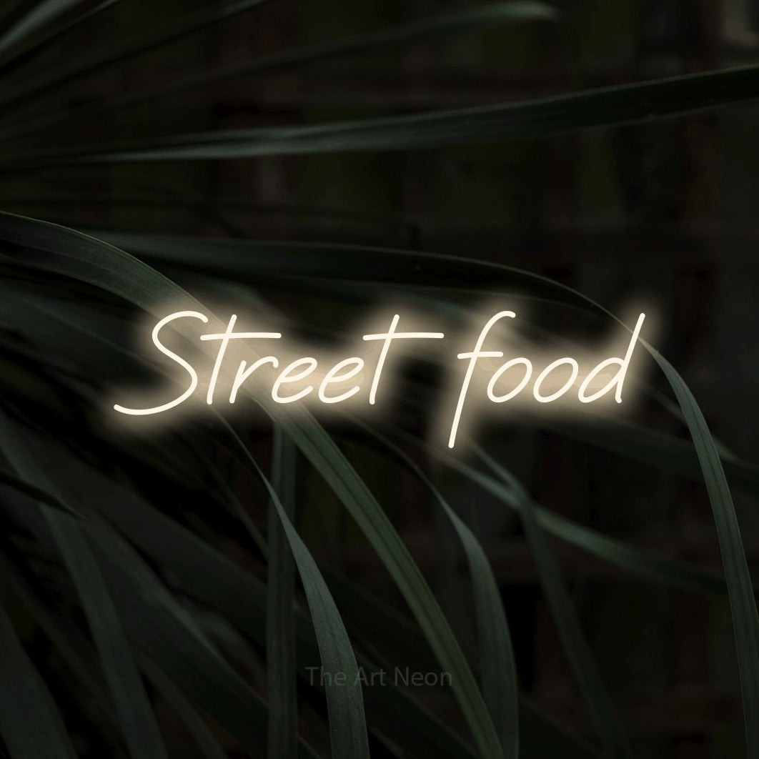 LED neon sign reading “Street food”, arranged in a single line.