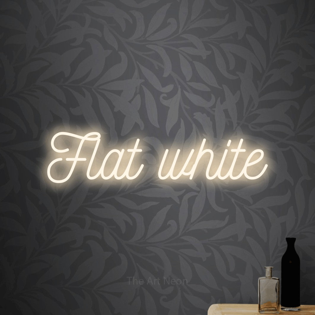 LED neon sign reading “Flat white”, arranged in a single line.