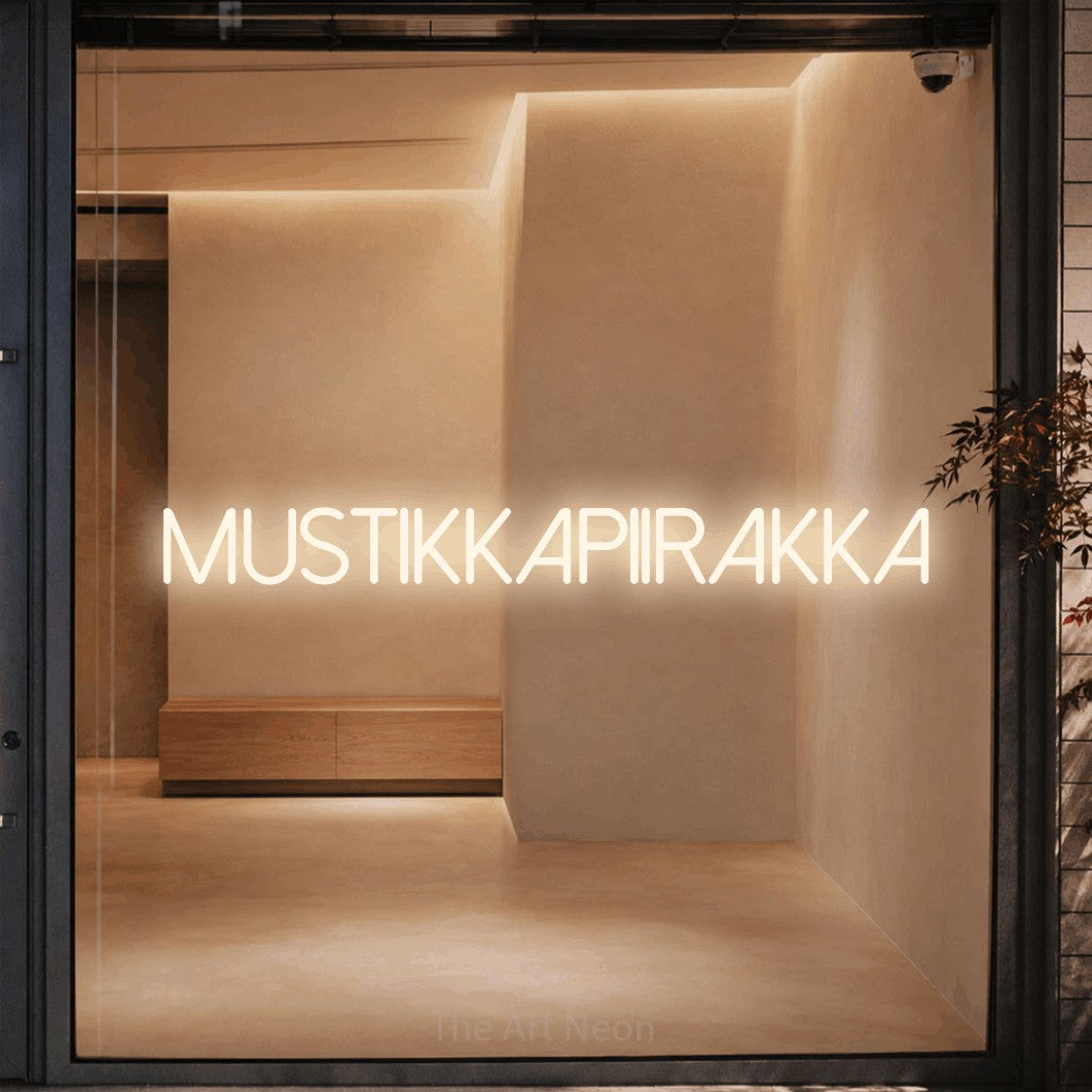 LED neon sign reading “mustikkapiirakka”, arranged in a single line.