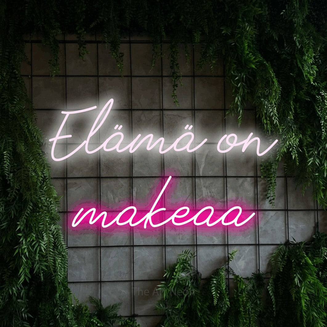 LED neon sign reading “Elämä on makeaa”, arranged in 2 lines.
