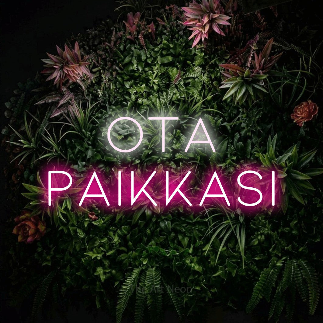 LED neon sign reading “Ota paikkasi”, arranged in 2 lines.