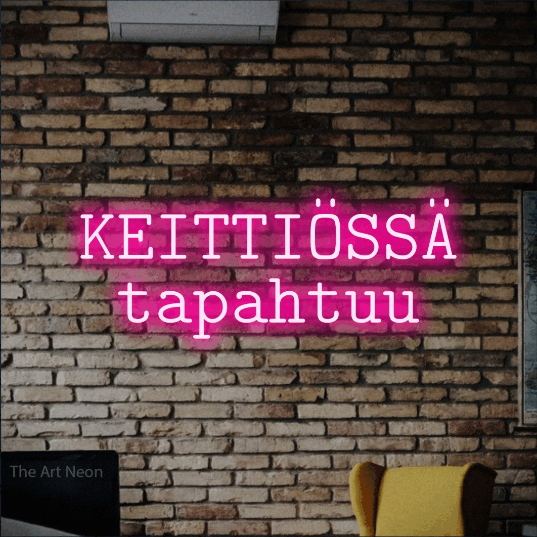 LED neon sign reading “KEITTIÖSSÄ tapahtuu”, arranged in 2 lines.