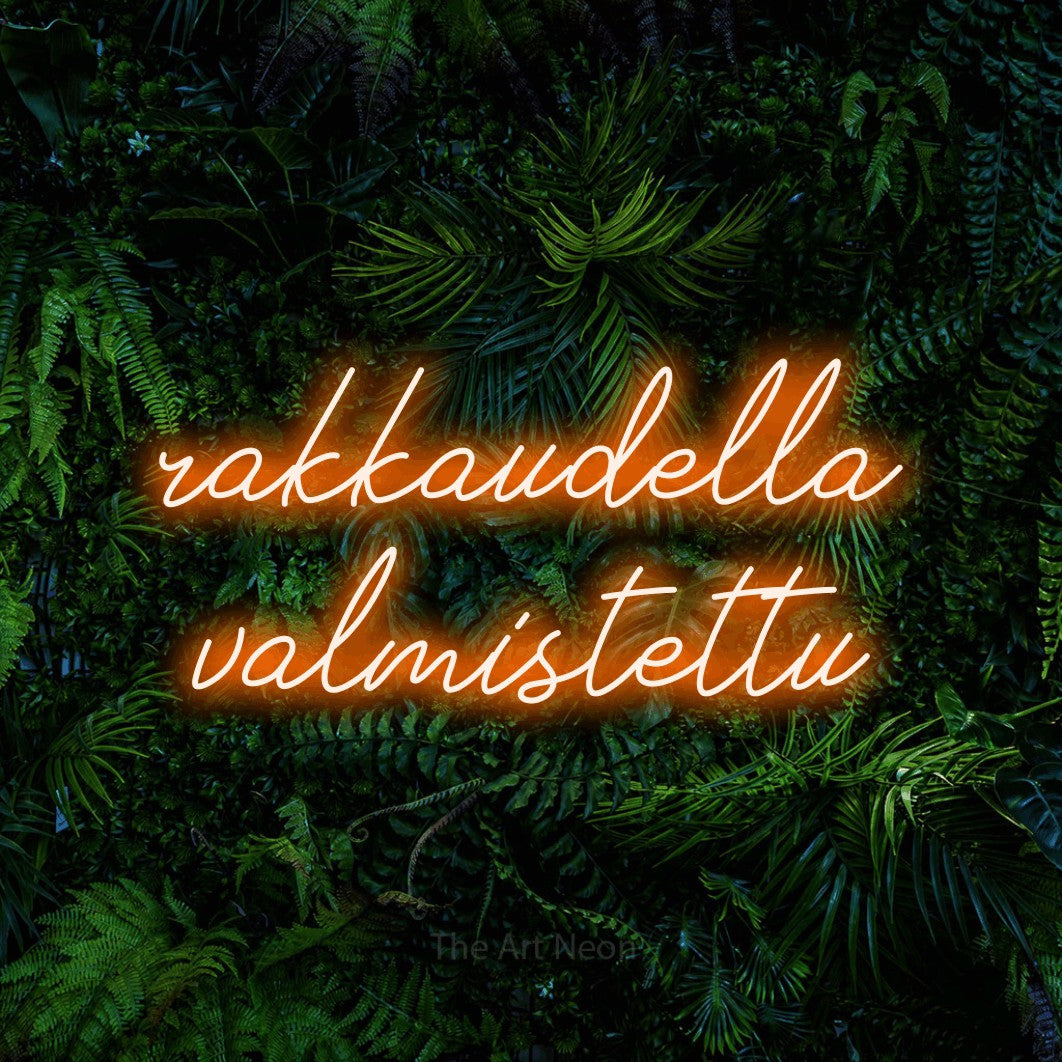 LED neon sign reading “rakkaudella valmistettu”, arranged in 2 lines.