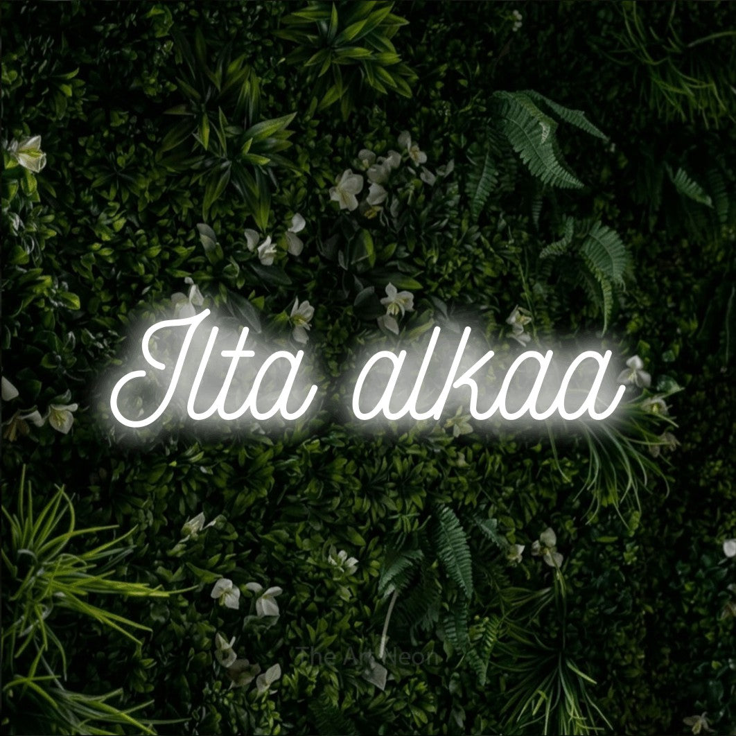 LED neon sign reading “Ilta alkaa”, arranged in a single line.