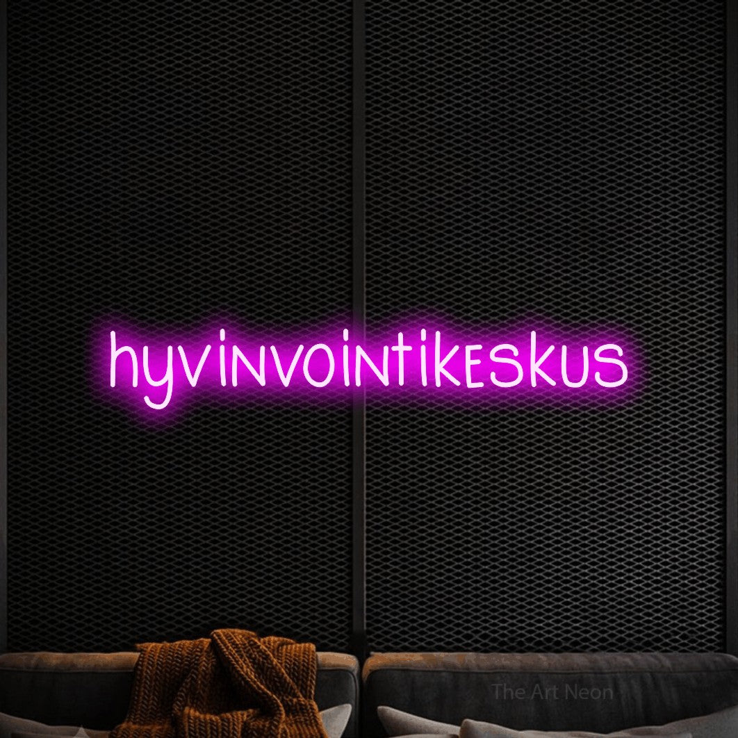 LED neon sign reading “hyvinvointikeskus”, arranged in a single line.