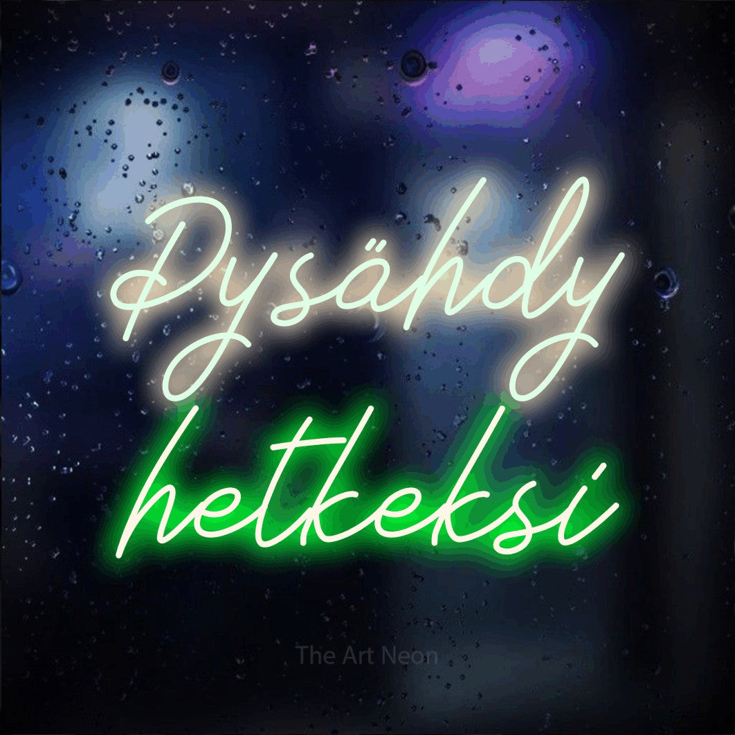LED neon sign reading “Pysähdy hetkeksi”, arranged in 2 lines.