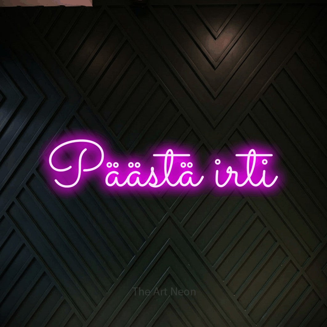 LED neon sign reading “Päästä irti”, arranged in a single line.