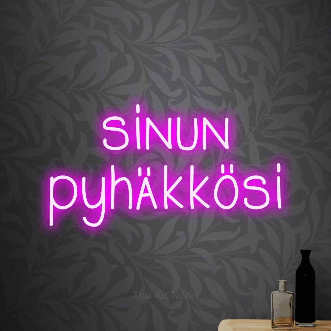 LED neon sign reading “sinun pyhäkkösi”, arranged in 2 lines.