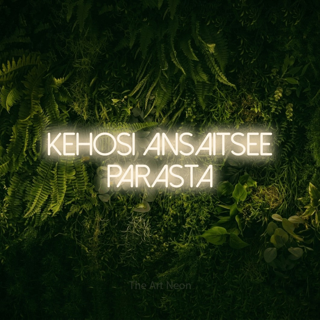LED neon sign reading “kehosi ansaitsee parasta”, arranged in 2 lines.
