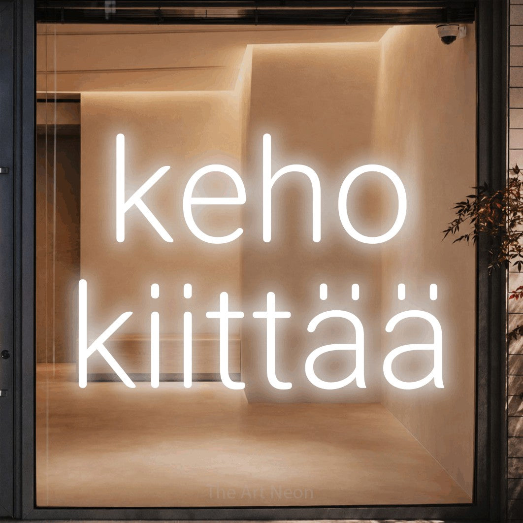 LED neon sign reading “keho kiittää”, arranged in 2 lines.
