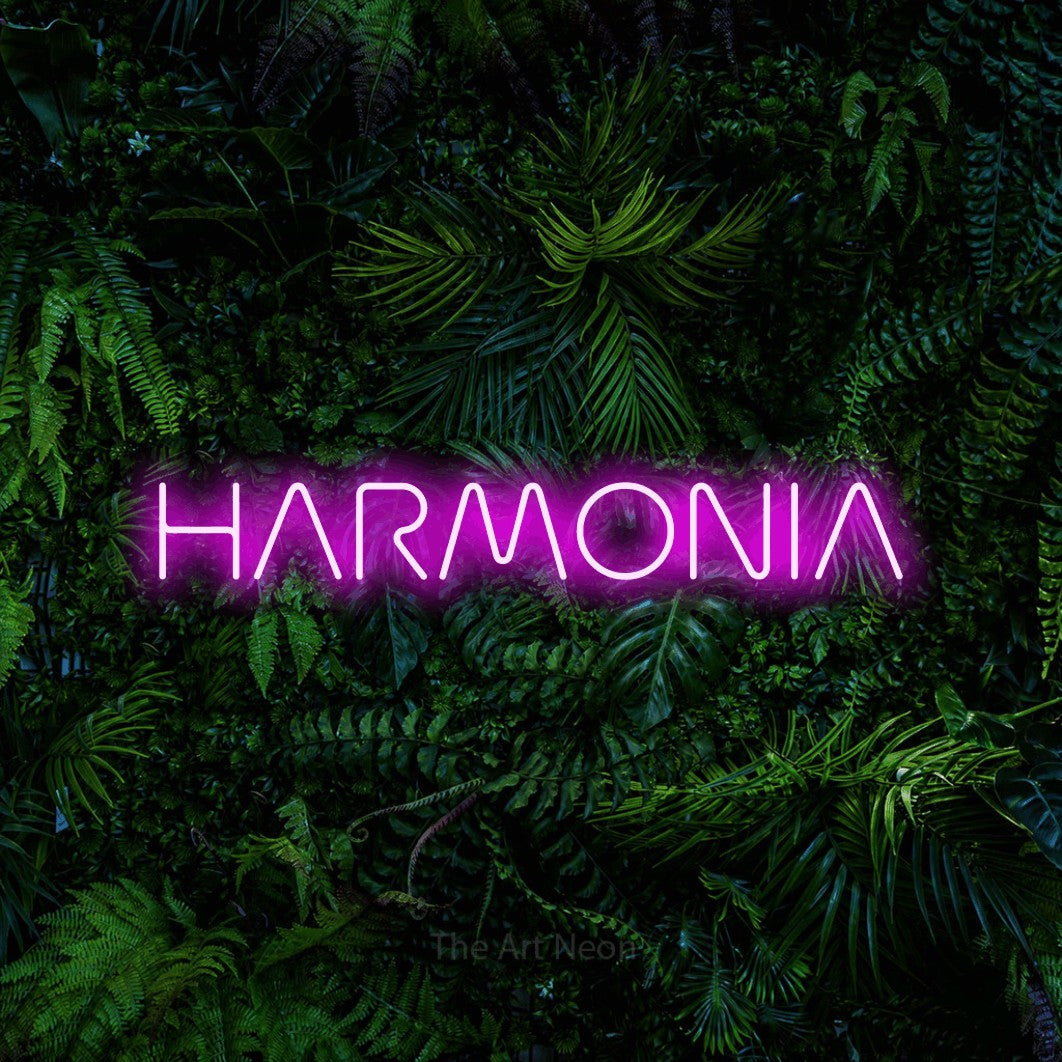 LED neon sign reading “HARMONIA”, arranged in a single line.