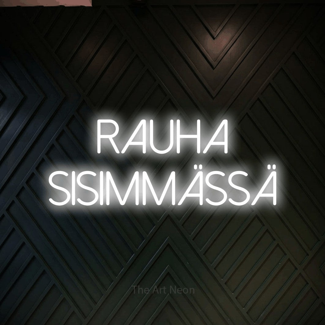 LED neon sign reading “rauha SISIMMÄSSÄ”, arranged in 2 lines.