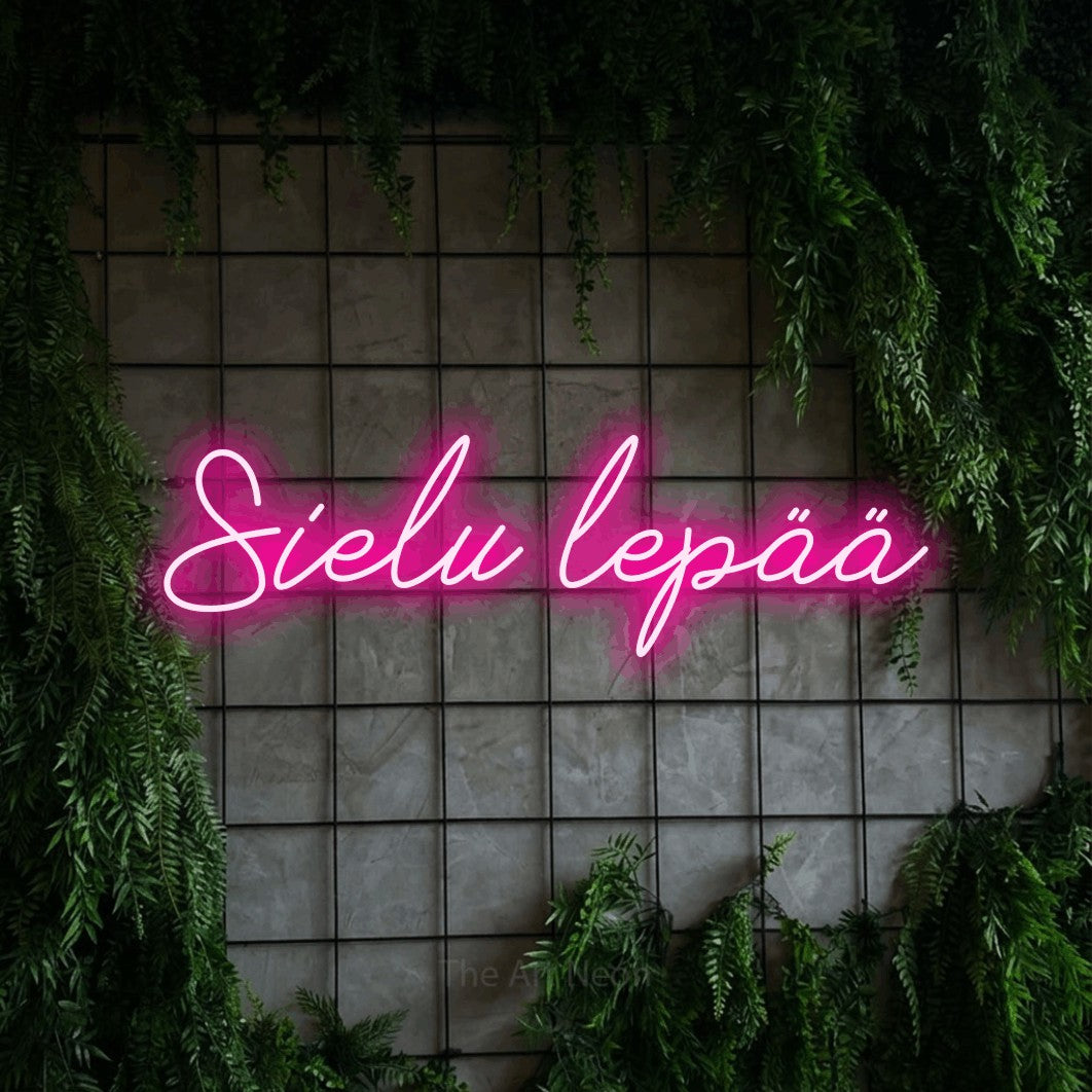 LED neon sign reading “Sielu lepää”, arranged in a single line.