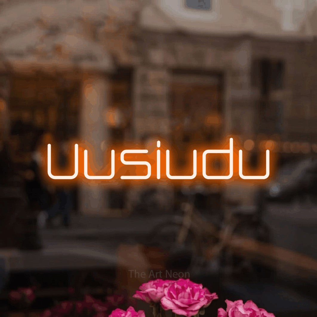 LED neon sign reading “Uusiudu”, arranged in a single line.
