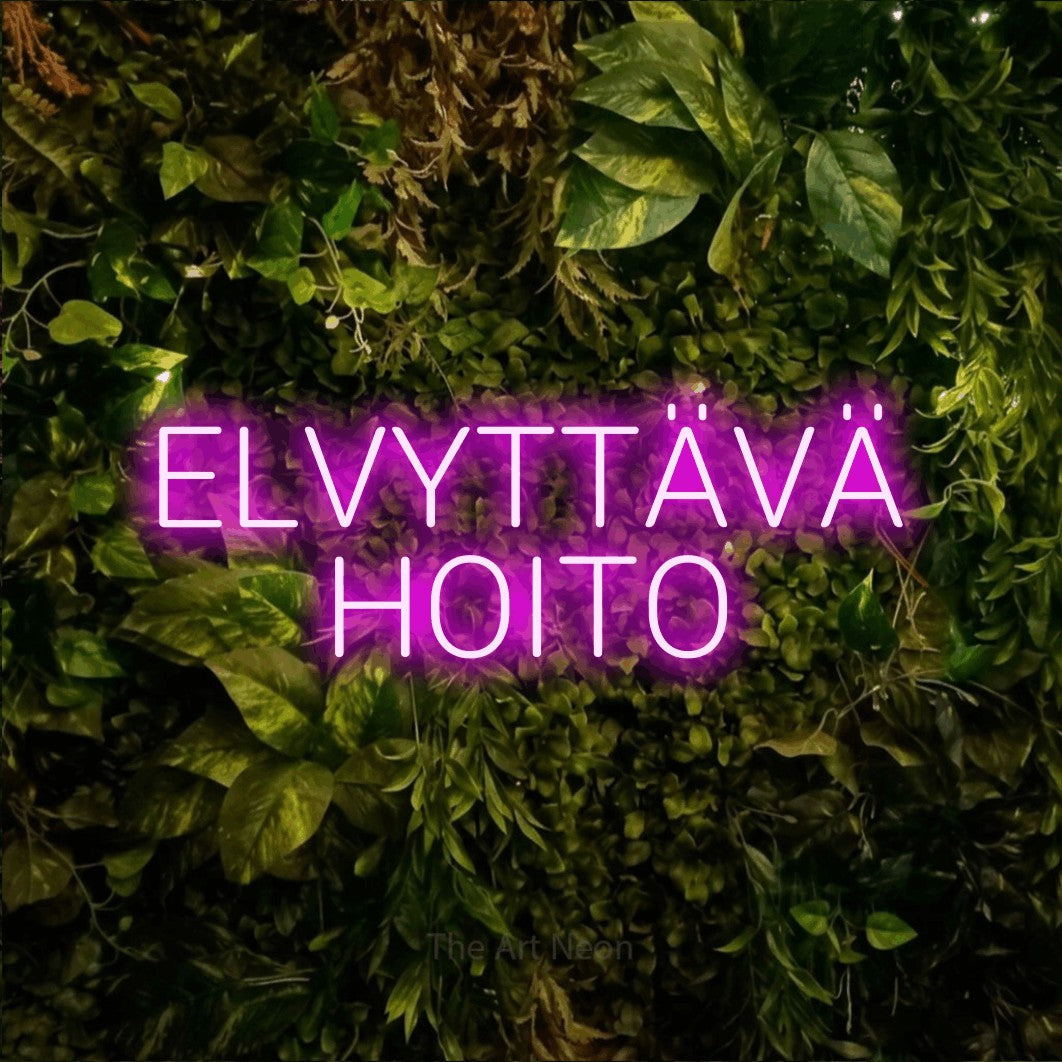 LED neon sign reading “ELVYTTÄVÄ HOITO”, arranged in 2 lines.