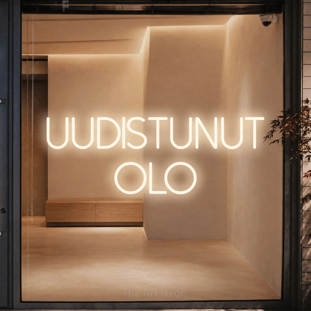LED neon sign reading “Uudistunut olo”, arranged in 2 lines.