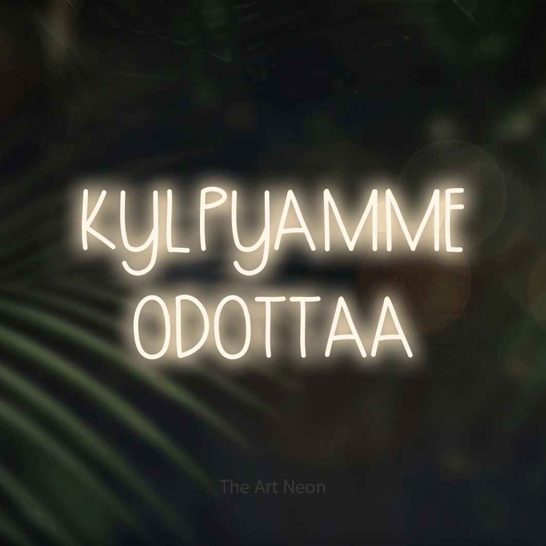 LED neon sign reading “KYLPYAMME ODOTTAA”, arranged in 2 lines.