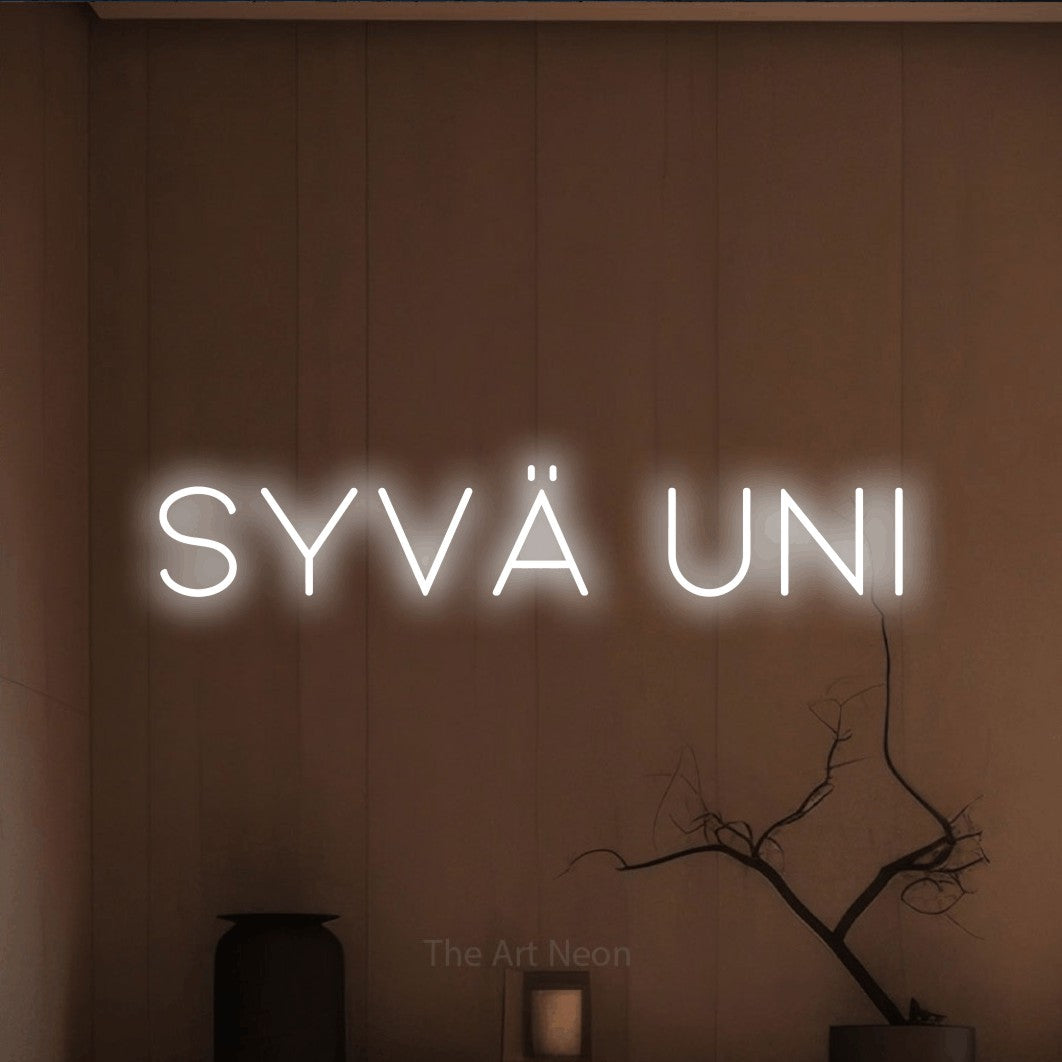 LED neon sign reading “Syvä uni”, arranged in a single line.