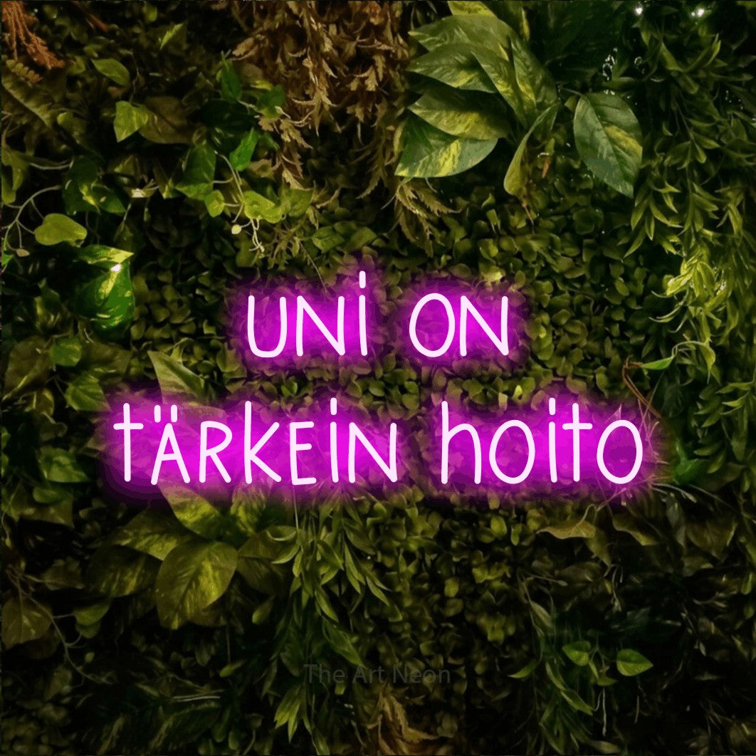 LED neon sign reading “uni on tärkein hoito”, arranged in 2 lines.