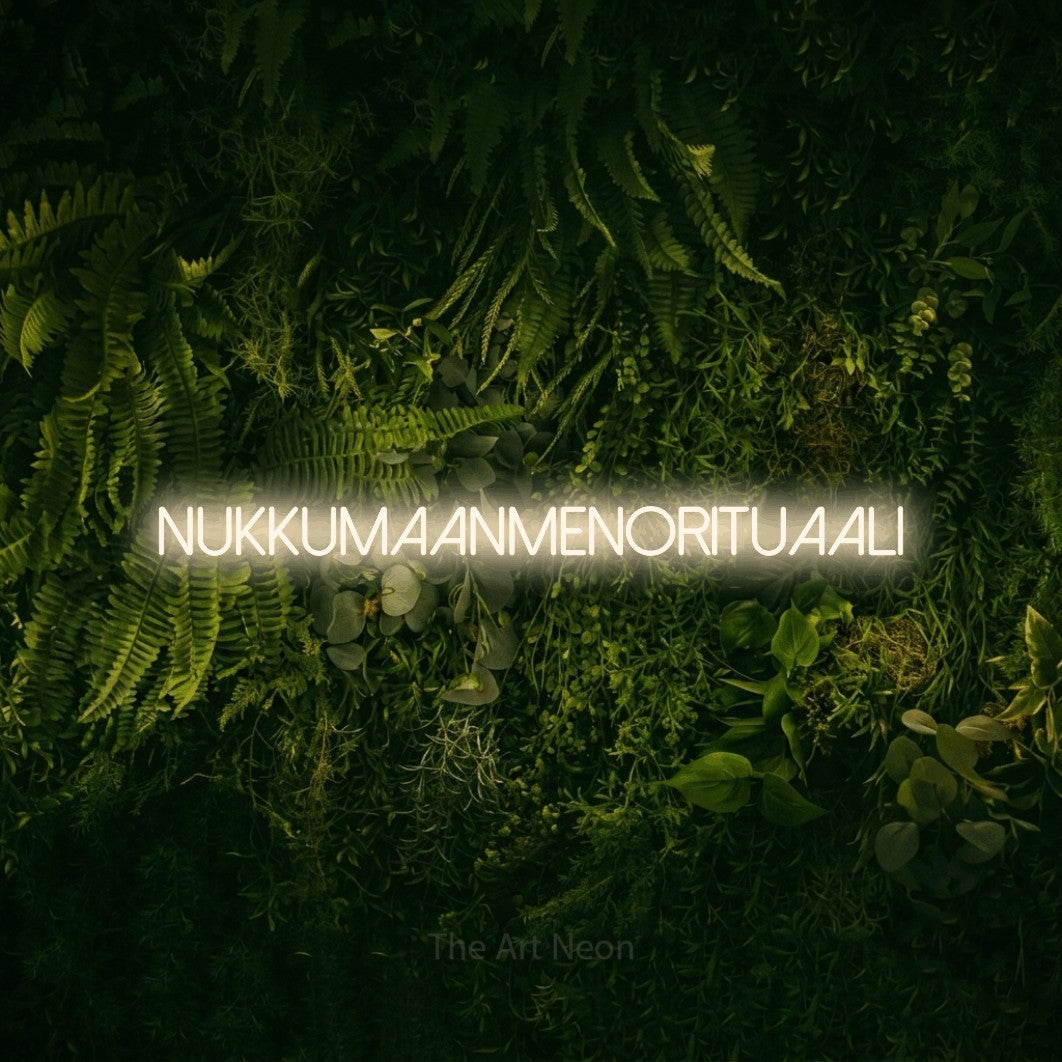 LED neon sign reading “Nukkumaanmenorituaali”, arranged in a single line.