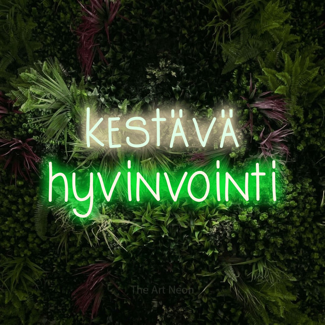 LED neon sign reading “kestävä hyvinvointi”, arranged in 2 lines.