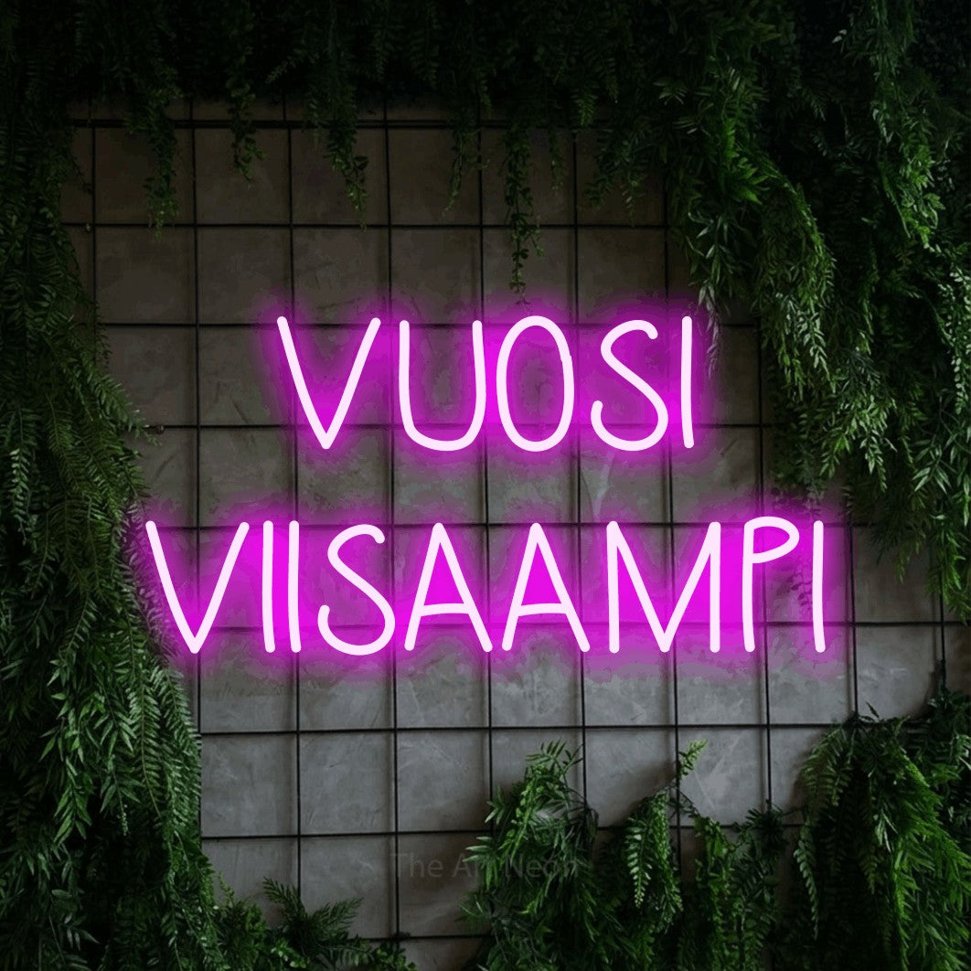 LED neon sign reading “VUOSI VIISAAMPI”, arranged in 2 lines.