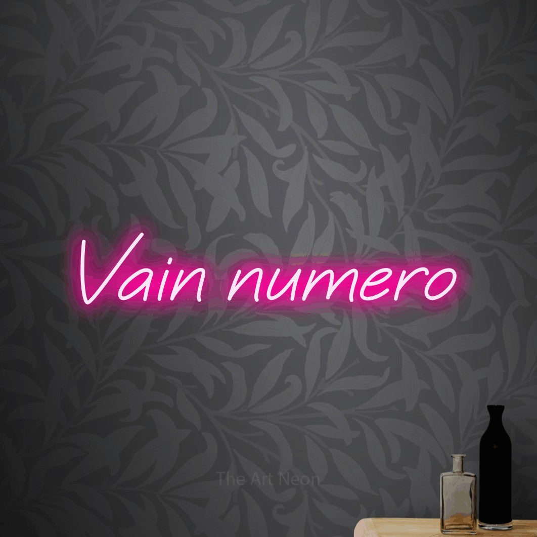 LED neon sign reading “Vain numero”, arranged in a single line.