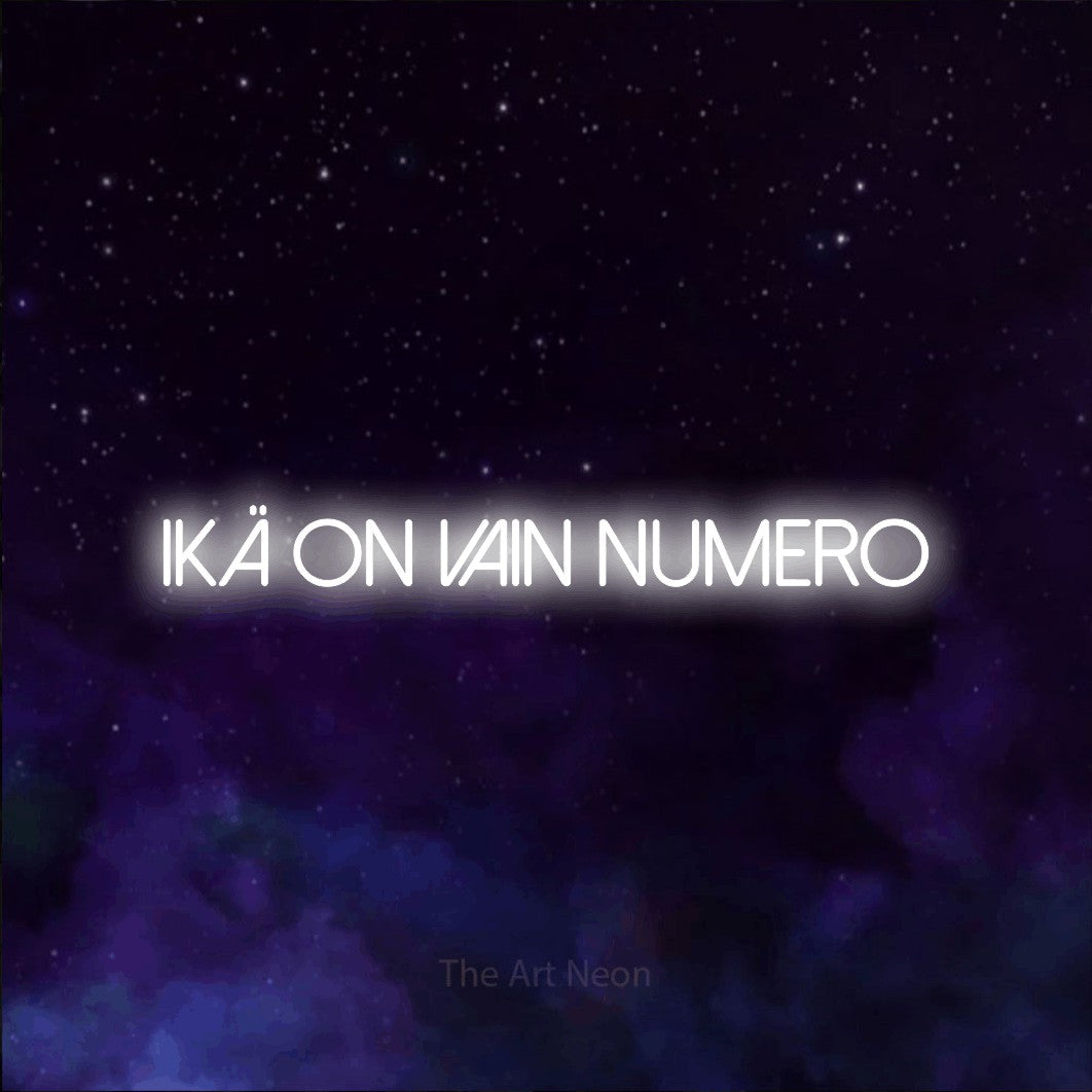 LED neon sign reading “ikä on vain numero”, arranged in a single line.